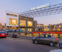 محل دور ارضي للبيع the market mall القاهره الجديده علي محور جمال عبدالناصر مباشره يصلح لكافه الانشطه