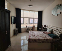 Apartment for rent in Ajman, Orient Towers, two bedrooms and a hall, sea view, large area, close to all services